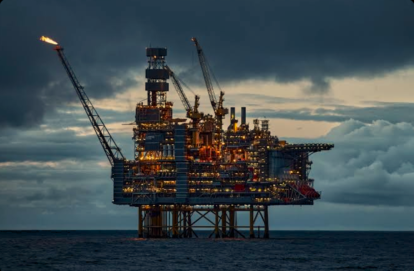 Offshore oil and gas platform at dusk representing the heavy-duty industrial environments where Arasweld protective welding gloves are utilized for worker safety