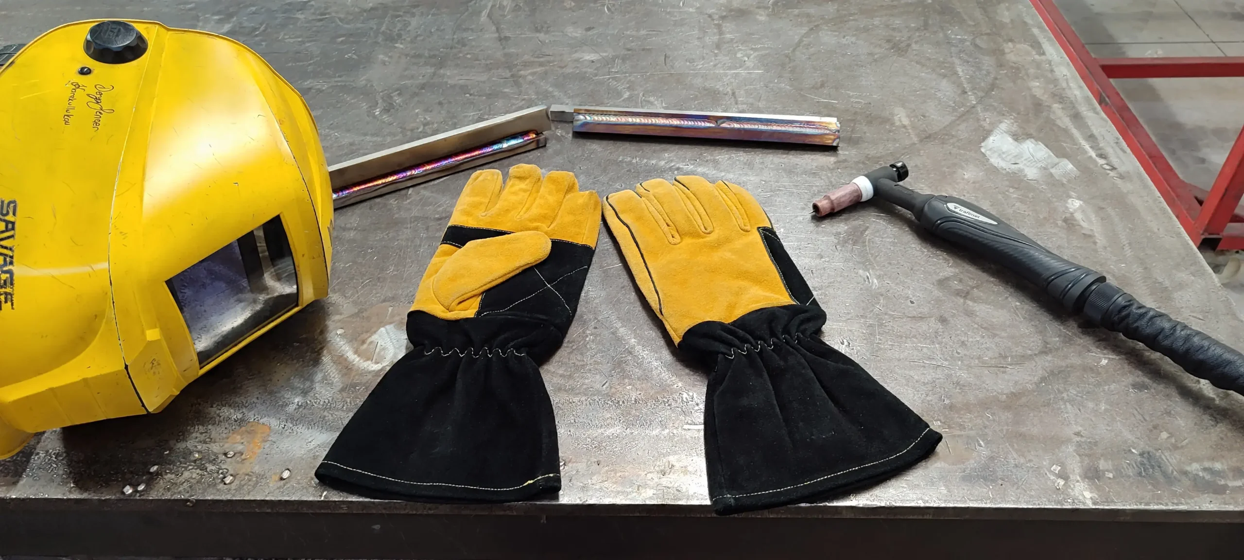 Arasweld High quality Cowhide leather welding gloves with a welding helmet and TIG torch, illustrating the durability, heat resistance, comfort, and abrasion resistance that make cowhide an ideal leather for MIG TIG and Stick welding applications.