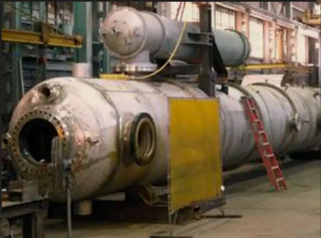 Large industrial pressure vessel being fabricated in a manufacturing, welded by welders using arasweld heat-resistant leather welding gloves.